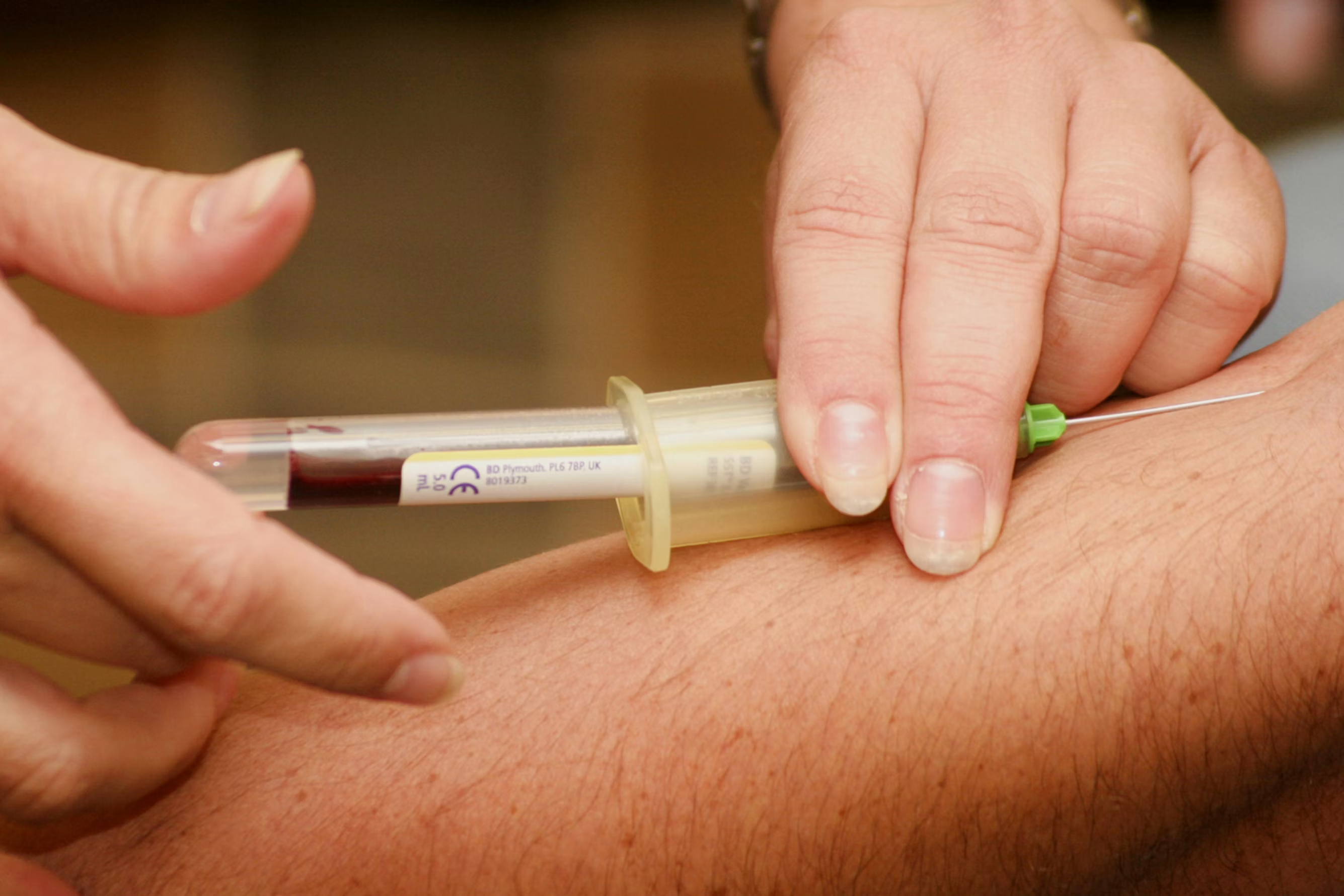 Nurse performing an at-home blood draw